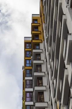 Steep low angle perspective of a modern residential building facade. Concept Stock Photos
