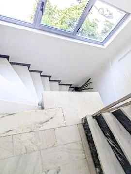 Steep Marble Staircase with Skylight Creating a Safety Hazardstaircase, sta.. Stock Photos