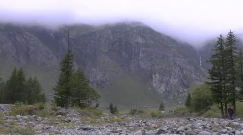 Steep Mountain with Cloud-Covered Sky and Rocky Floor 動画素材 41601516