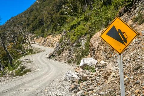 Steep mountain road warning Stock Photos