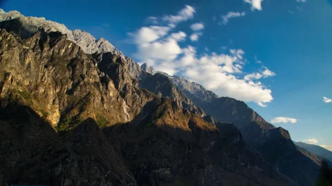Steep mountain,Light and shadow streaked across the mountains until darkness. Stock Footage 166018326