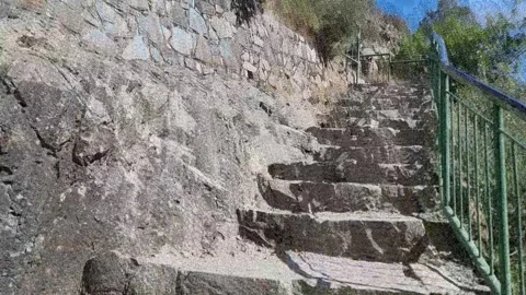 Steep railed stone stairs in Cyprus gorge Stock Footage 328098342