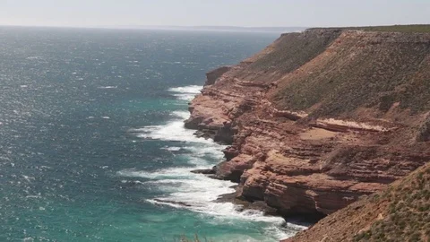 Steep red sea cliffs of Kalbarri NP in Australia Stock Footage 70952972