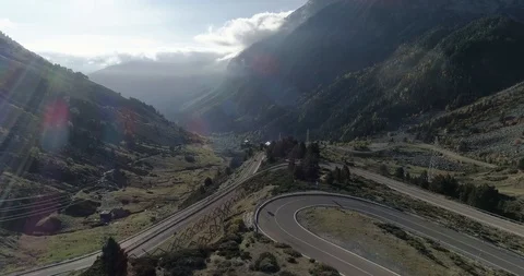 Steep roads with tight bends going up valley drone aerial 4k Stock Footage 125758394