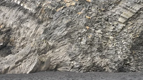 Steep Rock Cliffs at Reynisdrangar Black Beach, Iceland Video stock 97408933