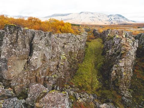 Steep rock wall, two exposed tectonic plates meeting in Thingvellir National Stock Photos