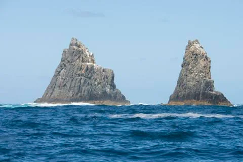 Steep rocky cliffs in remote ocean Tasmania Stock Photos
