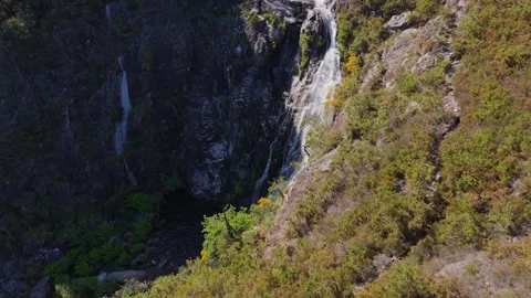 Steep Rocky Cliffs With Tourón Waterfall Stockbeeldmateriaal 340198312