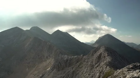Steep Rocky Mountain Range with Hut Pan 4K Stock Footage 67478672