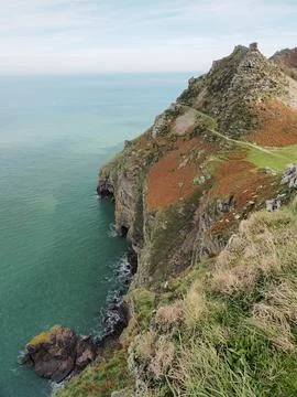 Steep sea cliffs and Rugged Jack from Castle Rock, Exmoor, Devon Stock Photos