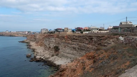 Steep shore of rocky cliffs, stretching into sea. Stock Footage 105842732