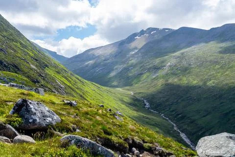 Steep sided valley in mountain range Stock Photos