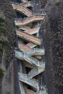 Steep steps rising up Guatape Rock, the Piedra el Penol, Colombia Stock Photos