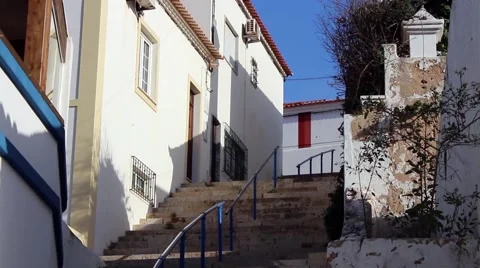 Steep stone steps between typical Portuguese houses Stock Footage 64809748