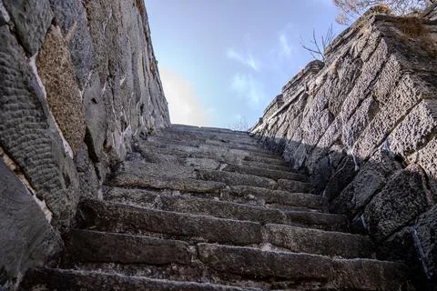 Steep stone steps enclosed by Great Wall walls Stock Photos