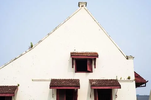The steep triangular gable wall and red clay-tiled window awnings of Fort R.. Stock Photos