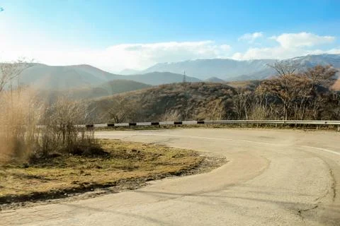 Steep turn in the mountains. Stock Photos