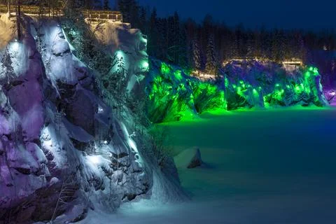 The steep wall of the Marble Canyon in multi-colored illumination 스톡 사진