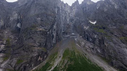 Steep-walled canyon carved through layered rock with vertical columnar format Foto stock