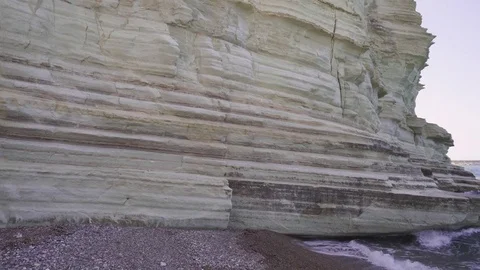 Steep white cliff above blue sea. Panning shot at sunny day Stock-Footage 76989310