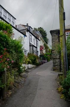 Steep, winding path among a cluster of cottages, Port Isaac, Cornwall, UK. Stock Photos