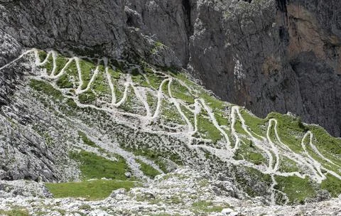 Steep zig zag path going up the dolomites mountain european alps in summer .. 스톡 사진