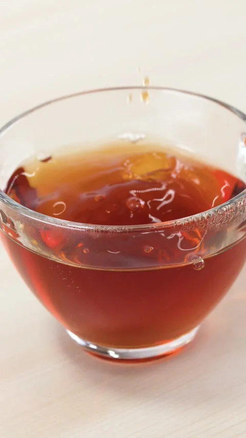 Steeping Tea Bag in Glass Cup with Hot Water Stock Footage 346271403