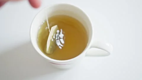 Steeping Tea An Enjoyable and Tranquil Brewing Process That Comes in a Mug and Stock Footage 305245517