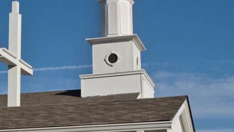 Steeple in the sky behind pine tree 4K Stock Footage 163767158