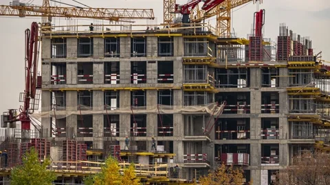 Steeplejack workers on construction activities, construction of the housing e Stock Footage 163323535