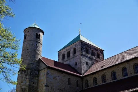 Steeples and tree branches in front of St. Michael's Church in Hildesheim Stock Photos