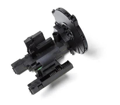 Steering angle sensor disassembled on a white isolated background, spare part Photos