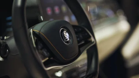 Steering wheel and dashboard of Byd tang EV electric car close-up. Stock Footage 256799707