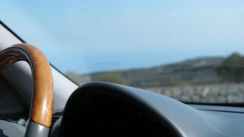 Steering wheel and dashboard driving in volcanic island 動画素材 148204976