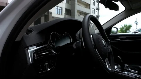 Steering wheel and digital dashboard in car Stock Footage 89934289
