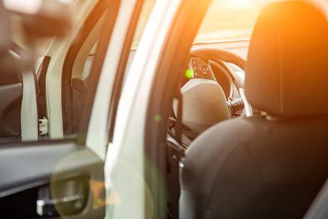 Steering wheel and empty driver's seat of new premium suv car seen from the rear Stock Photos