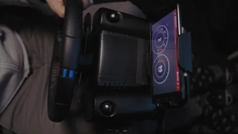 Steering Wheel and A man using a driving simulator Stock Footage 258384737