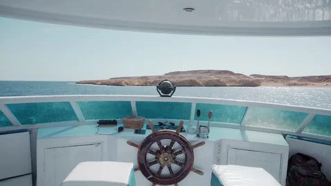 Steering wheel and navigation compass on a yacht at sea. The concept of managing Stock Footage 91150724