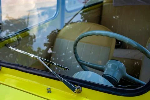Steering wheel behind the windshield Stock Photos