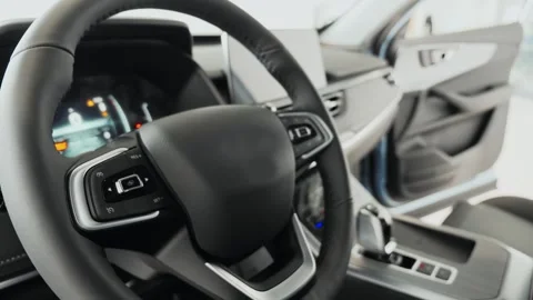 The steering wheel of a car. The Driver Perspective, High-Tech Sedan Dashboard Stock Footage 257765539
