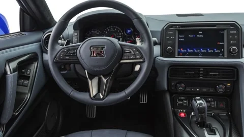 Steering wheel in car interior 2020 Nissan GT-R Premium 50th Anniversary Video stock 160106382