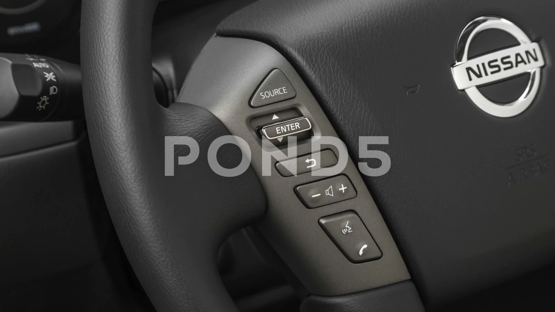 Steering wheel control buttons close up 2019 Nissan Armada SV