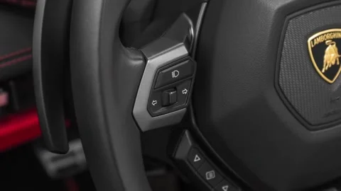 Steering wheel control buttons close up 2019 Lamborghini Huracan Spyder LP580-2S Stock Footage 159833434