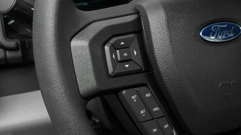 Steering wheel control buttons close up 2016 Ford F-150 XL Stock Footage 159863737