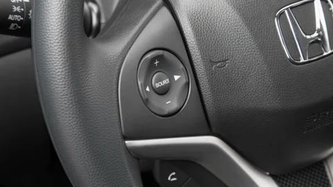 Steering wheel control buttons close up 2016 Honda Fit LX Stock Footage 159864488