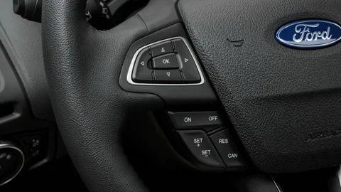 Steering wheel control buttons close up 2016 Ford Focus Titanium Stock Footage 159865962