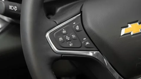 Steering wheel control buttons close up 2016 Chevrolet Malibu Premier Stock Footage 159872579