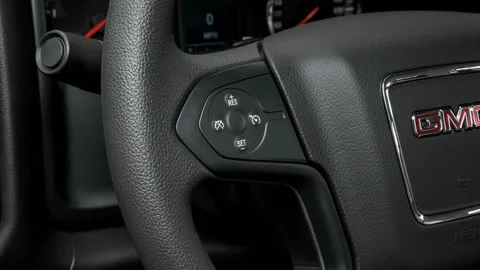 Steering wheel control buttons close up 2016 GMC Sierra 2500HD Stock Footage 159877620