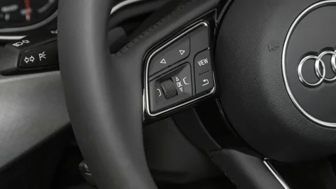 Steering wheel control buttons close up 2017 Audi A4 Premium 2.0 TFSI Video stock 159886454