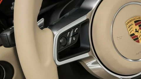 Steering wheel control buttons close up 2017 Porsche Macan S Stock Footage 159897082